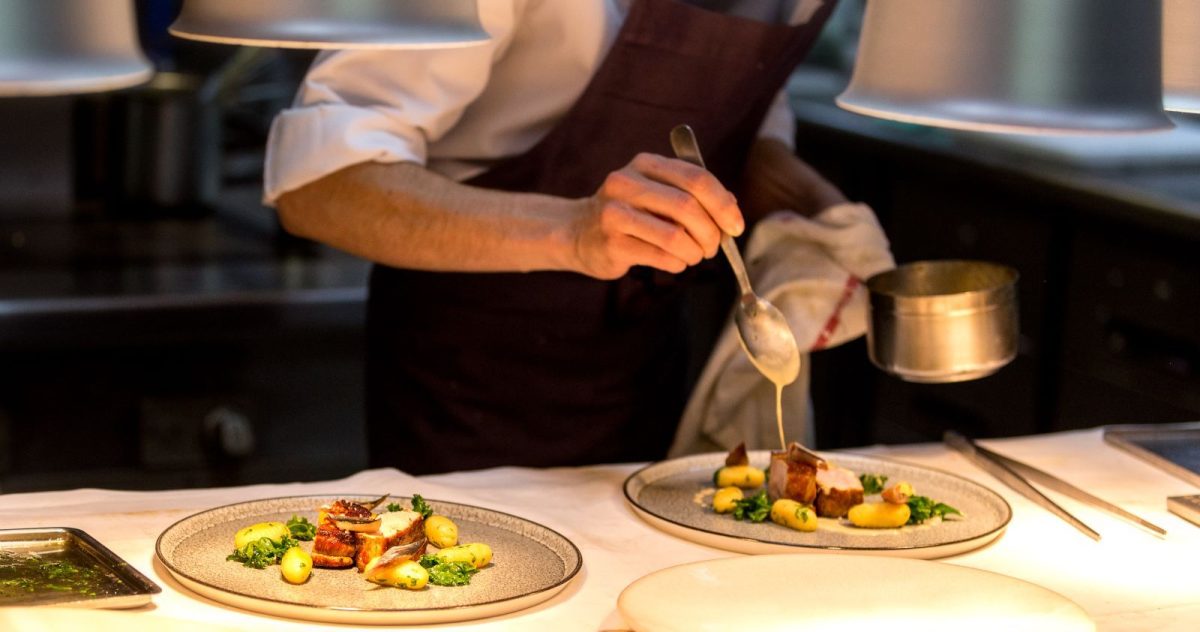 Chef plating dinner